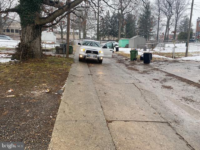 5605 Liberty Heights Avenue Baltimore, MD 21207 - Photo 6 of 6 a view of street with parked cars