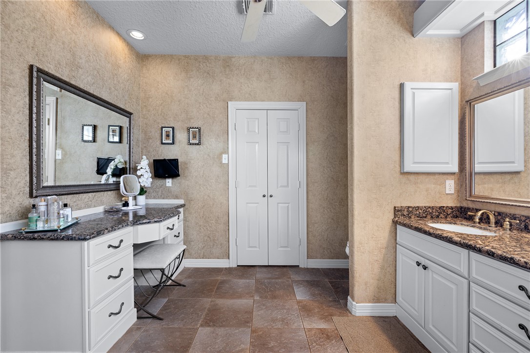 2250 Dillard Road Washington, TX 77880 - Photo 19 of 50 a bathroom with a double vanity sink and mirror