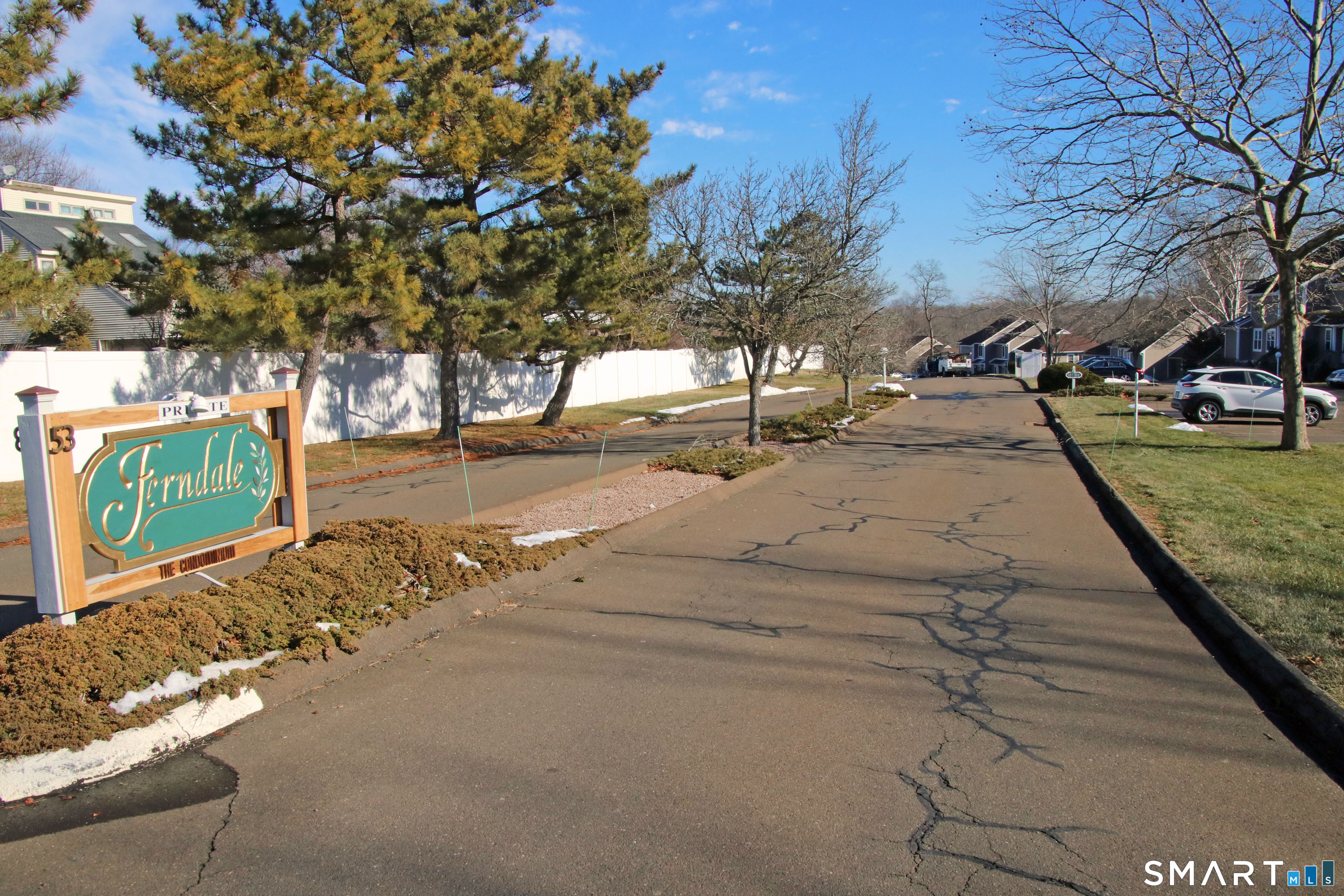 a view of a yard with cars parked