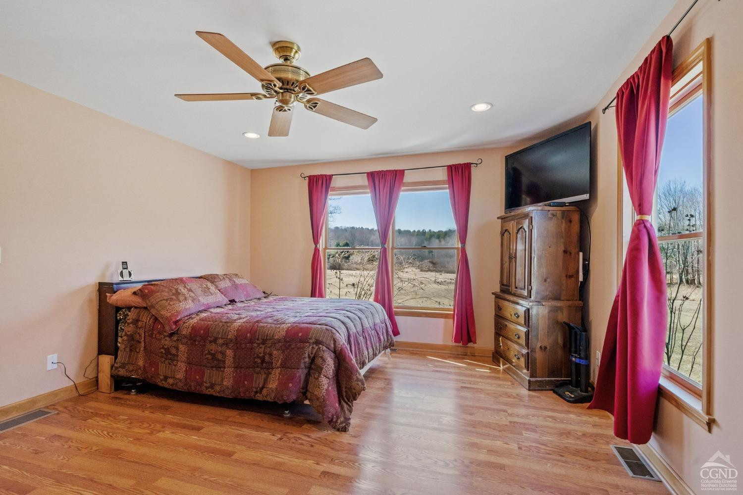 16 Deerfield Circle Copake, NY 12516 - Photo 11 of 40 a bed room with a bed and a flat screen tv