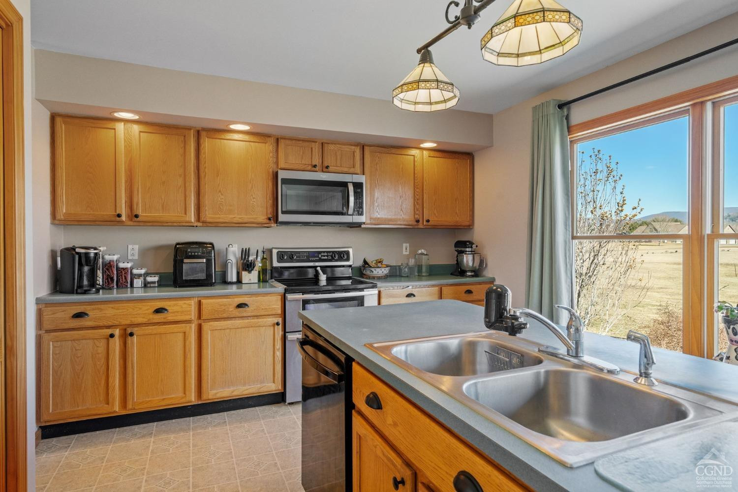 16 Deerfield Circle Copake, NY 12516 - Photo 7 of 40 a kitchen with stainless steel appliances granite countertop a sink a stove and a microwave