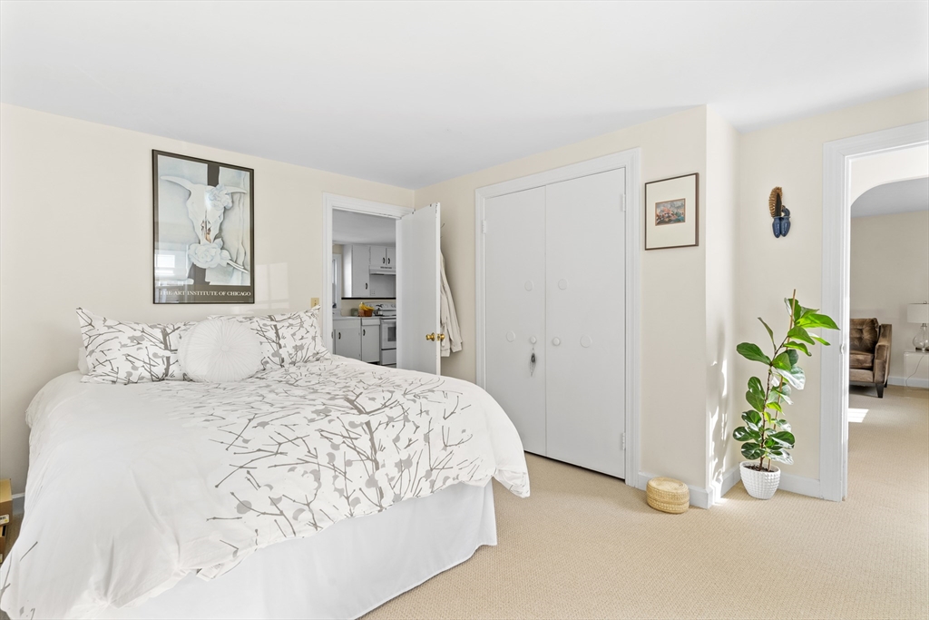 327 Bridle Path Worcester, MA 01604 - Photo 15 of 40 a bedroom with a bed and hallway