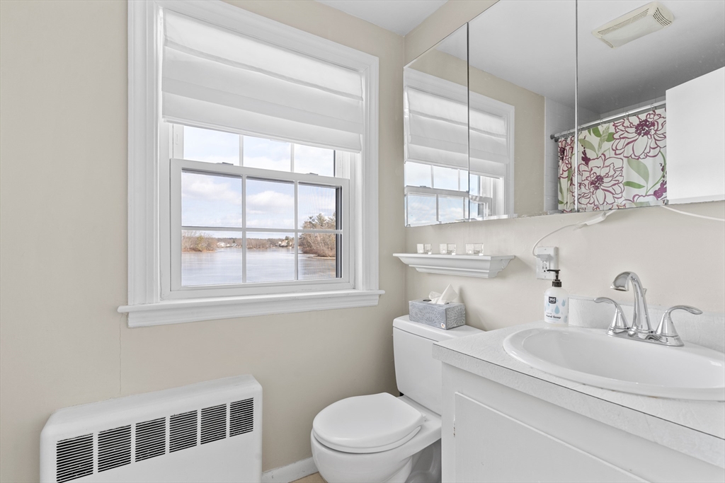 327 Bridle Path Worcester, MA 01604 - Photo 16 of 40 a bathroom with a sink a toilet and a window