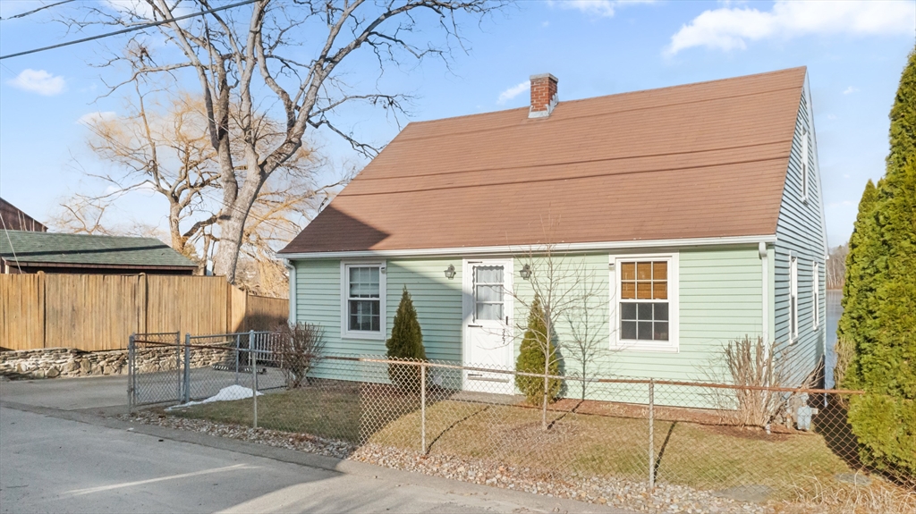 327 Bridle Path Worcester, MA 01604 - Photo 2 of 40 a house with a tree in front of it