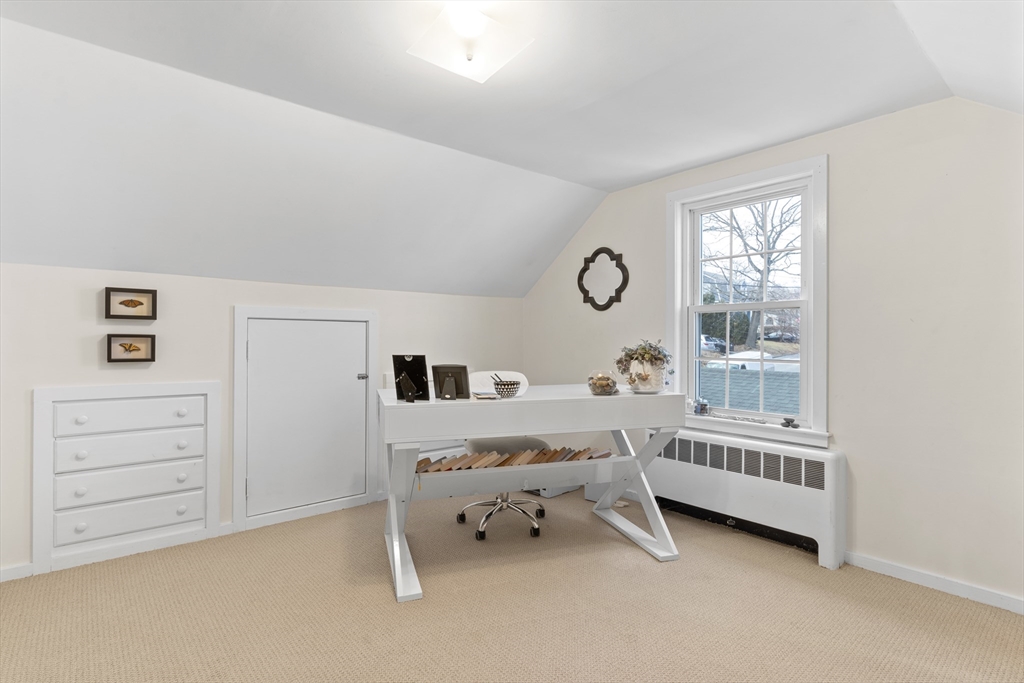 327 Bridle Path Worcester, MA 01604 - Photo 21 of 40 a room with a baby bed a dresser and a window