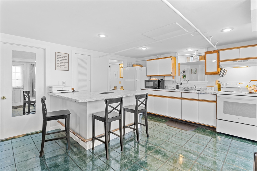327 Bridle Path Worcester, MA 01604 - Photo 22 of 40 a kitchen with a table and chairs in it