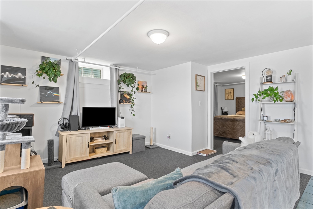 327 Bridle Path Worcester, MA 01604 - Photo 25 of 40 a bedroom with furniture and a flat screen tv