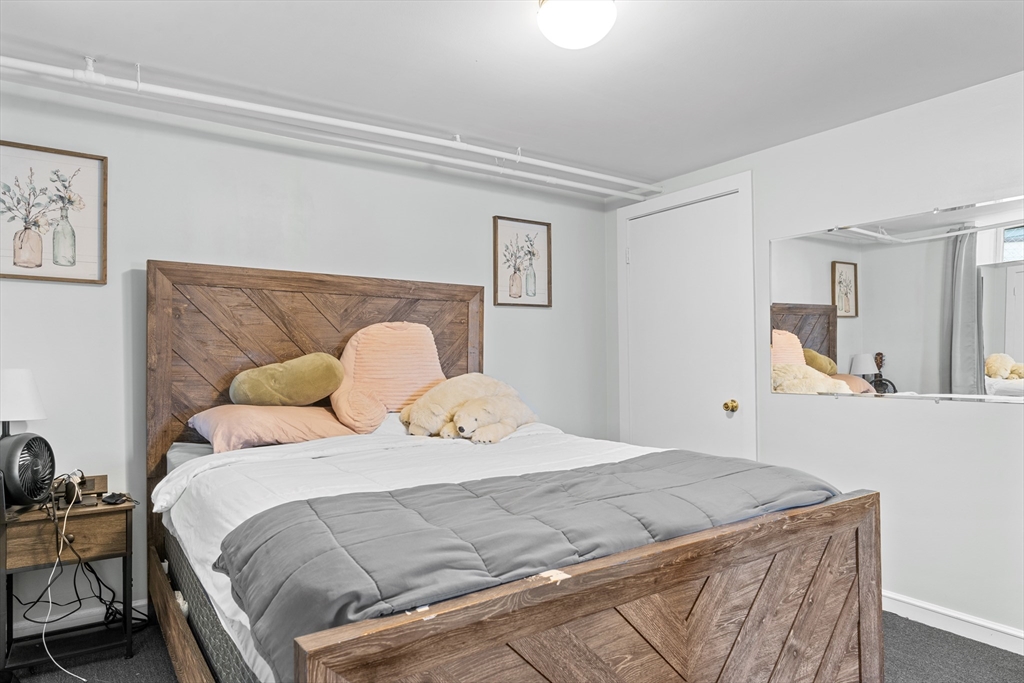 327 Bridle Path Worcester, MA 01604 - Photo 27 of 40 a bedroom with a bed and a table