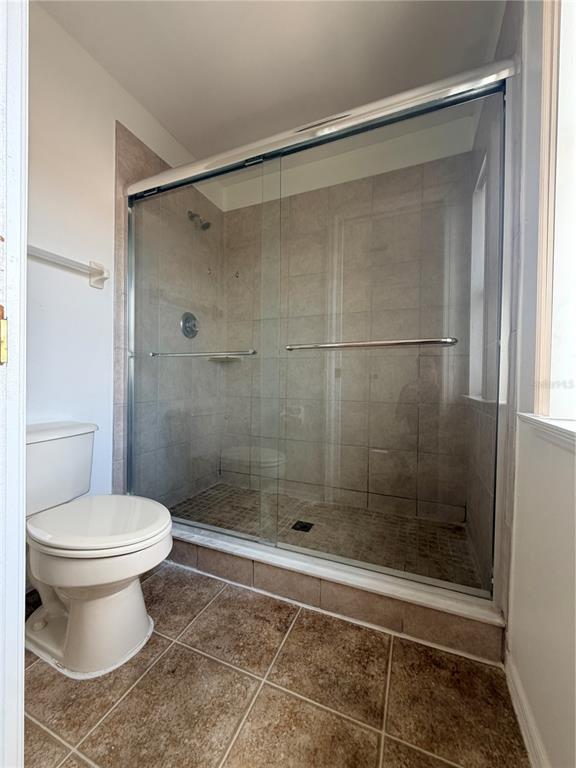 1214 Timberbend Circle Orlando, FL 32824 - Photo 20 of 31 a bathroom with a shower and a toilet