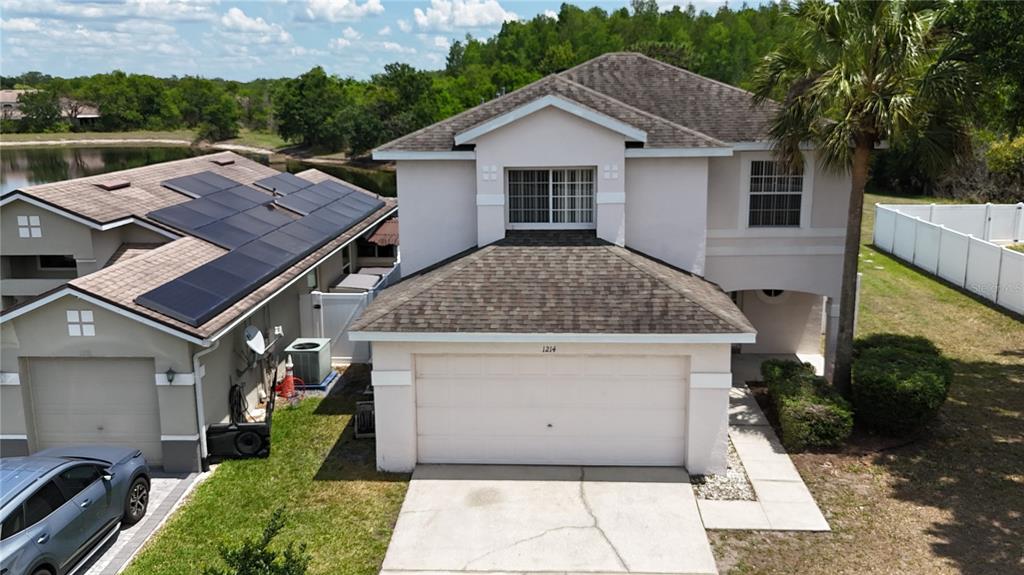 1214 Timberbend Circle Orlando, FL 32824 - Photo 2 of 31 a view of a house with a yard
