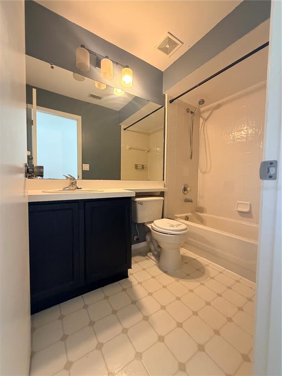 1214 Timberbend Circle Orlando, FL 32824 - Photo 22 of 31 a bathroom with a sink toilet and a mirror