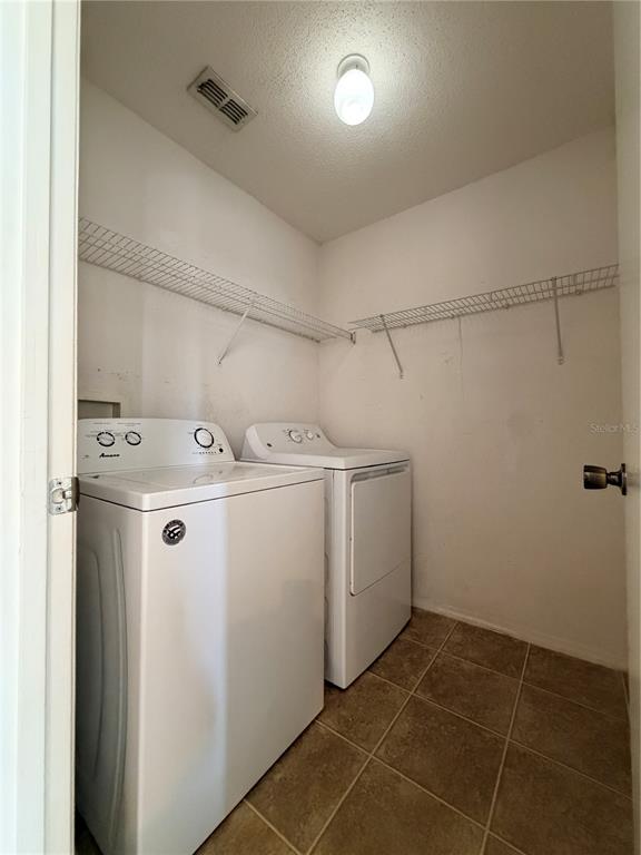 1214 Timberbend Circle Orlando, FL 32824 - Photo 24 of 31 a utility room with dryer and washer