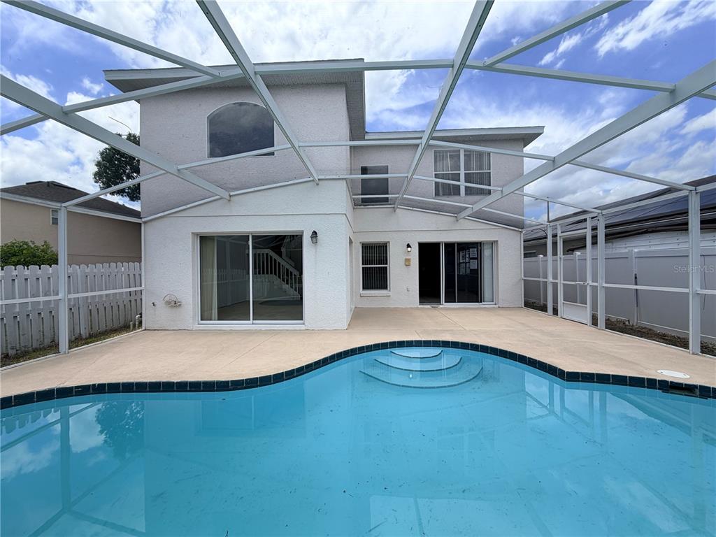 1214 Timberbend Circle Orlando, FL 32824 - Photo 27 of 31 a front view of a house with a yard