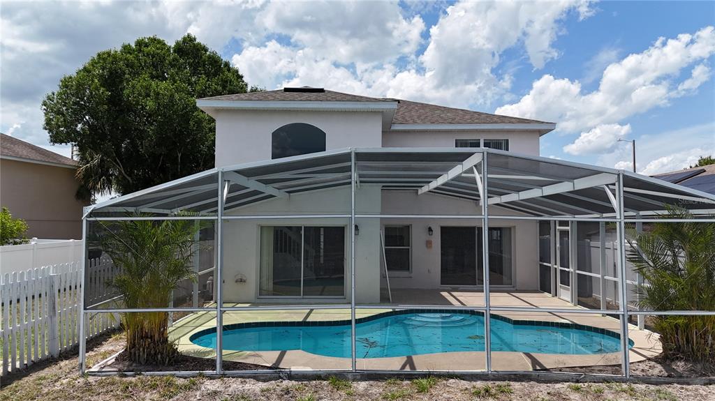 1214 Timberbend Circle Orlando, FL 32824 - Photo 28 of 31 a view of a house with roof yard