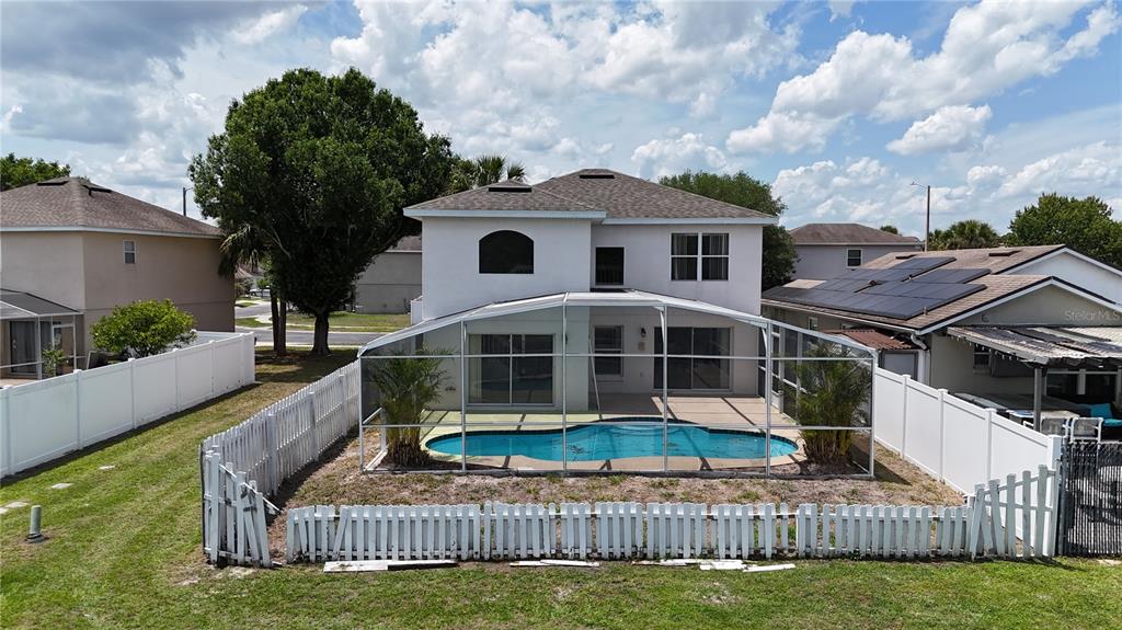 1214 Timberbend Circle Orlando, FL 32824 - Photo 29 of 31 a view of a house with a small yard and large trees
