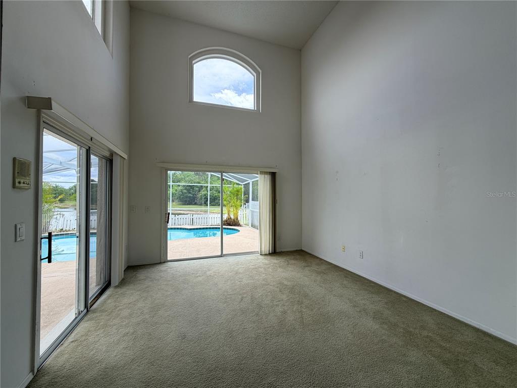 1214 Timberbend Circle Orlando, FL 32824 - Photo 5 of 31 an empty room with windows