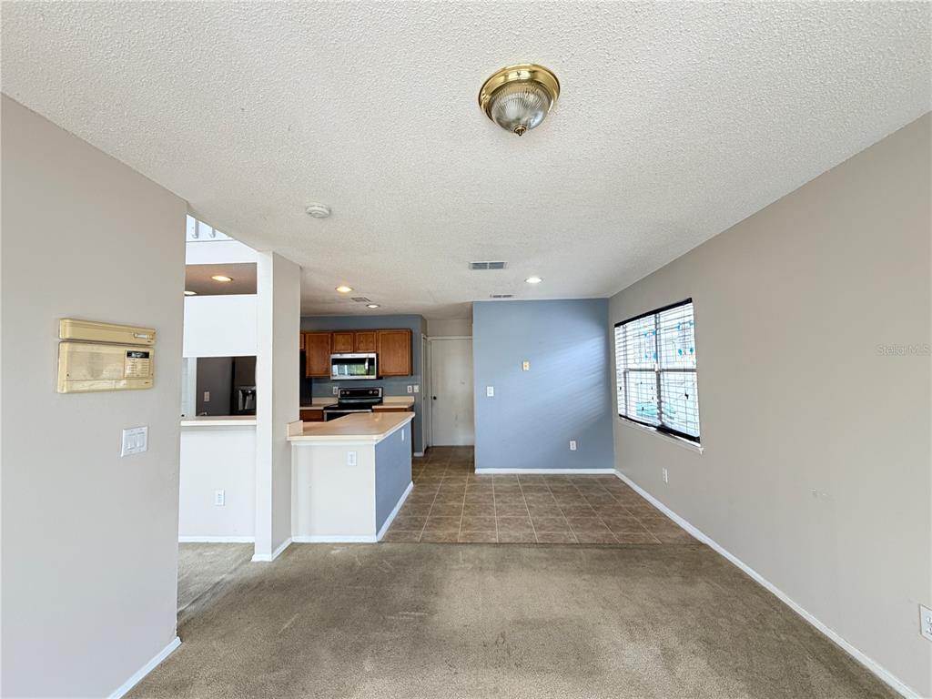 1214 Timberbend Circle Orlando, FL 32824 - Photo 8 of 31 a view of a kitchen with a sink dishwasher and a microwave