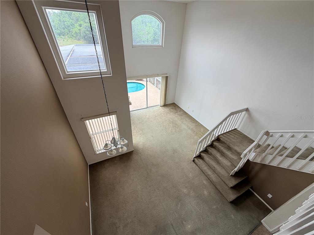 1214 Timberbend Circle Orlando, FL 32824 - Photo 9 of 31 a view of an empty room with windows
