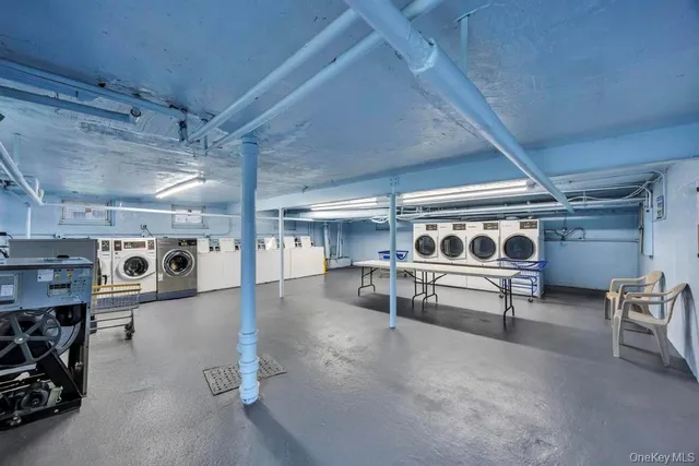 a bathroom with a shower sink vanity and toilet