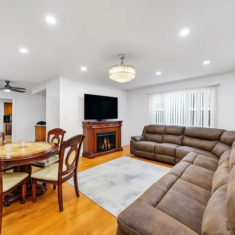 a large kitchen with granite countertop a sink and cabinets