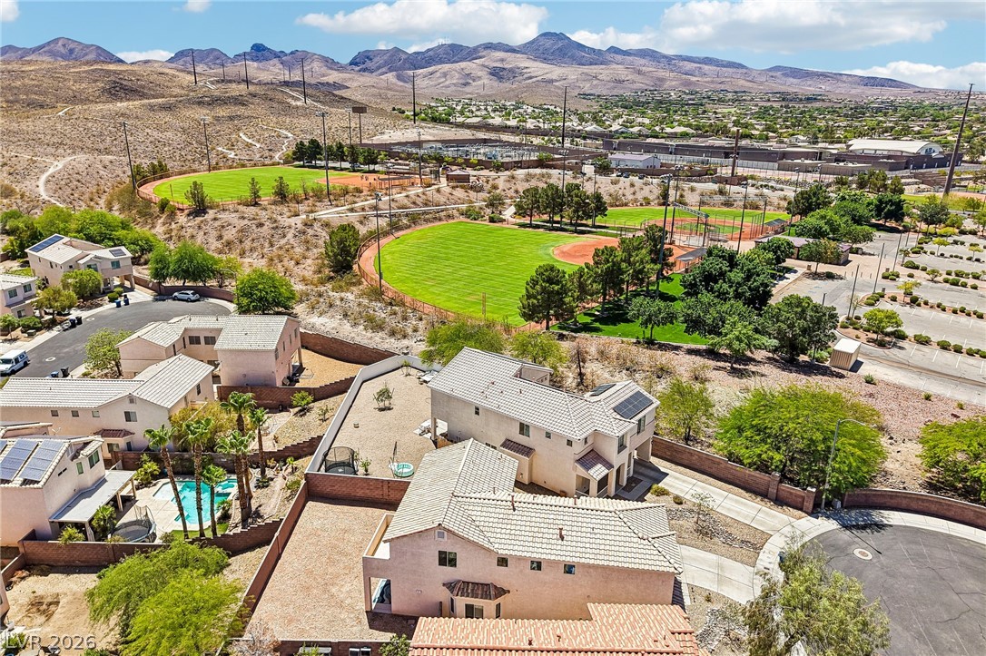 1176 Butternut Ranch Court Henderson, NV 89052 - Photo 52 of 60 Perched above the neighborhood, this residence enjoys expansive views of the adjacent park and distant mountains.