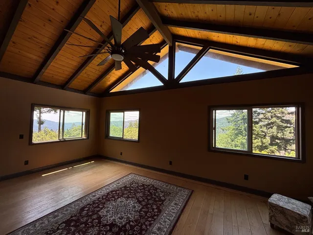 a view of an empty room with windows