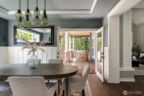 a view of a dining room with furniture and wooden floor