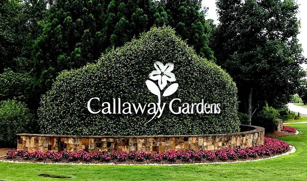 a view of outdoor space with sign board and garden