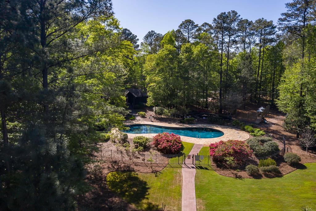 279 White Oak Road Pine Mountain, GA 31822 - Photo 5 of 25 a view of a swimming pool with a yard and plants