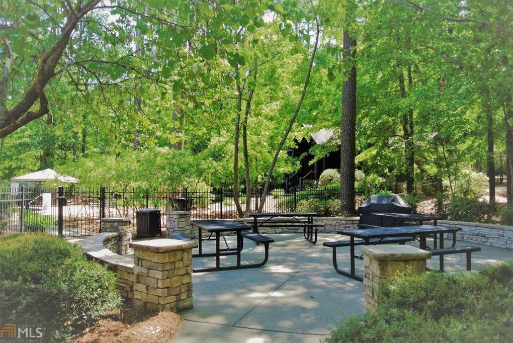 279 White Oak Road Pine Mountain, GA 31822 - Photo 10 of 25 a view of a patio with table and chairs potted plants and large tree