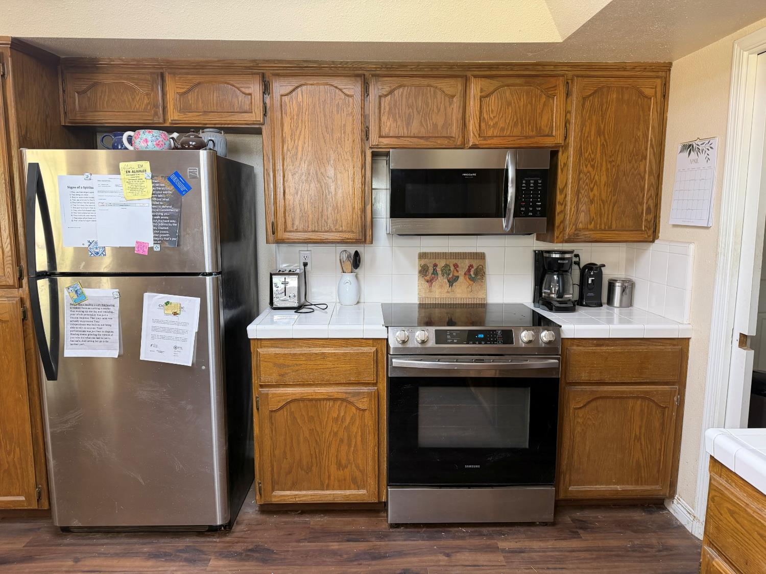 16638 Mark Road Madera, CA 93636 - Photo 12 of 22 a kitchen with stainless steel appliances a stove microwave and a refrigerator
