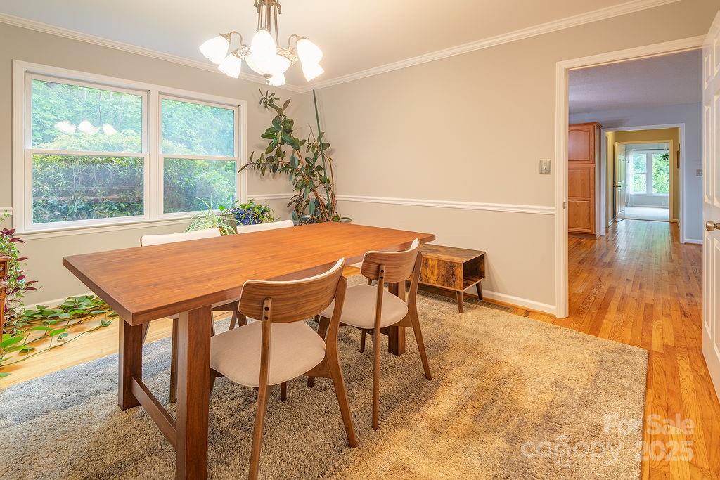 908 Newfound Road Leicester, NC 28748 - Photo 14 of 46 a dining room with furniture and window