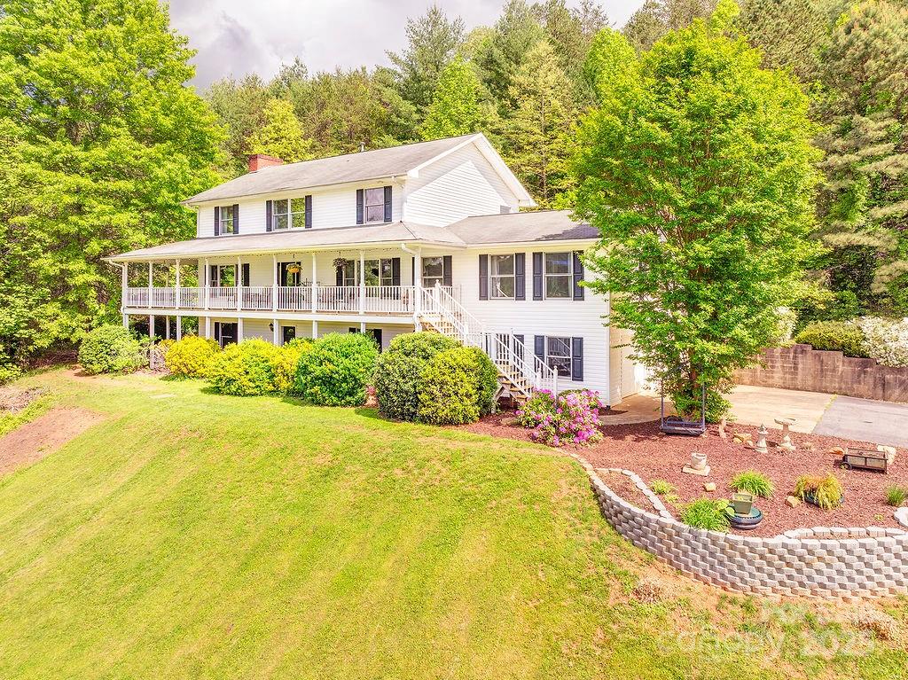 908 Newfound Road Leicester, NC 28748 - Photo 2 of 46 a view of a house with swimming pool