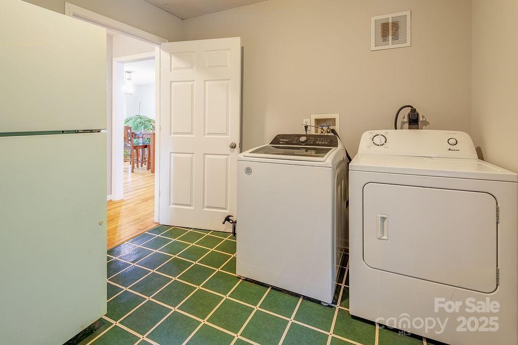 908 Newfound Road Leicester, NC 28748 - Photo 39 of 46 a utility room with dryer and washer