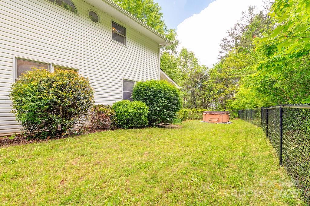 908 Newfound Road Leicester, NC 28748 - Photo 45 of 46 a view of a backyard with plants and large trees