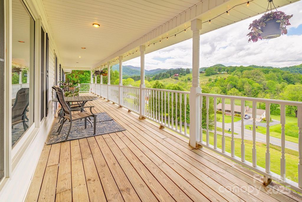 908 Newfound Road Leicester, NC 28748 - Photo 5 of 46 a view of balcony with wooden floor and seating space
