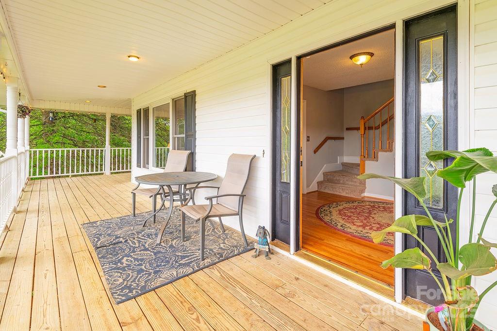 908 Newfound Road Leicester, NC 28748 - Photo 6 of 46 a view of a dining room with furniture window and outside view
