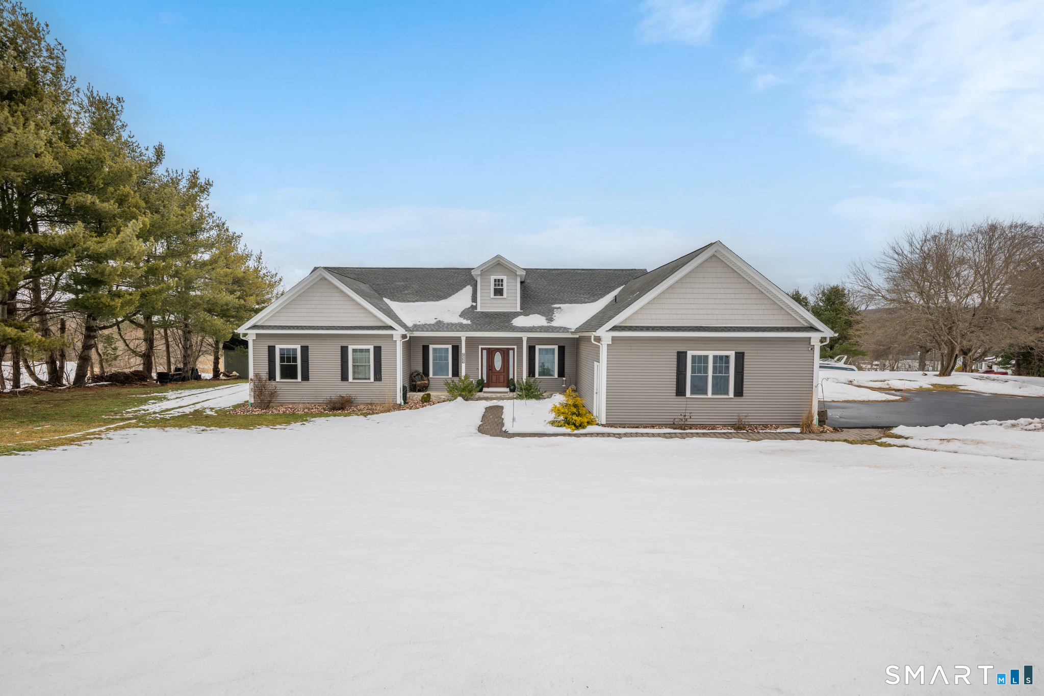 a front view of a house with yard