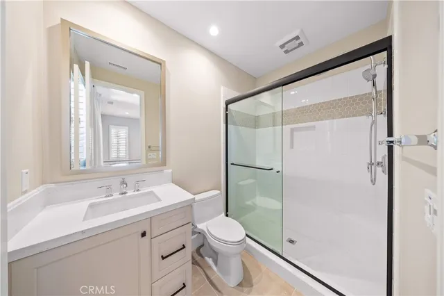 a view of a garden with a building in the background