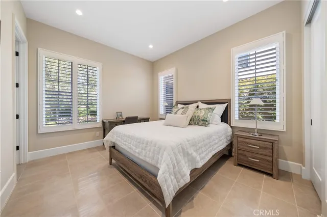 a bedroom with a large bed and a couch