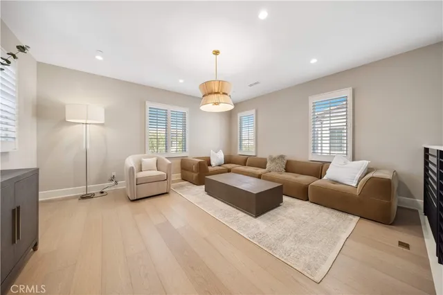 a view of washer and dryer with kitchen in the background