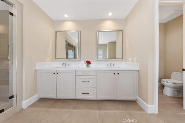 a living room with patio furniture and a potted plant