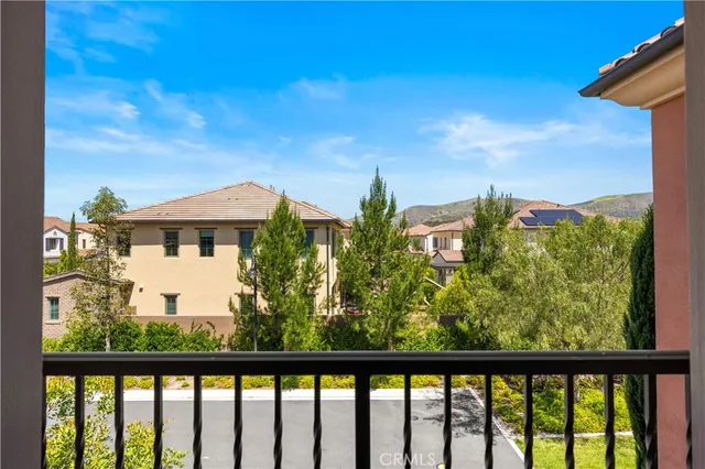 a view of a balcony with furniture