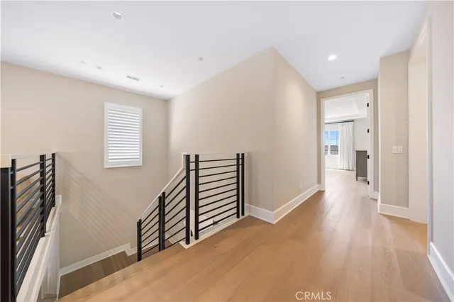 a bathroom with a shower sink mirror and toilet