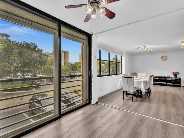 a view of a dining room with furniture window and outside view