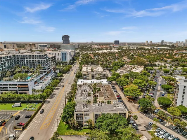 an aerial view of residential building with parking space