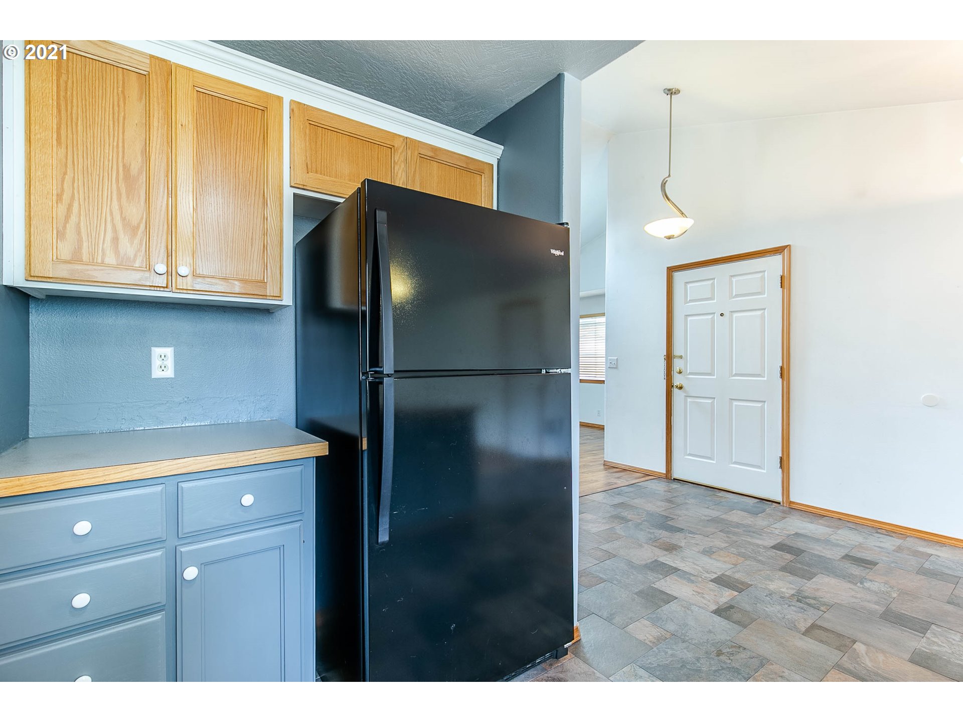4049 Virginia Avenue Springfield, OR 97478 - Photo 12 of 32 a kitchen with a refrigerator and cabinets