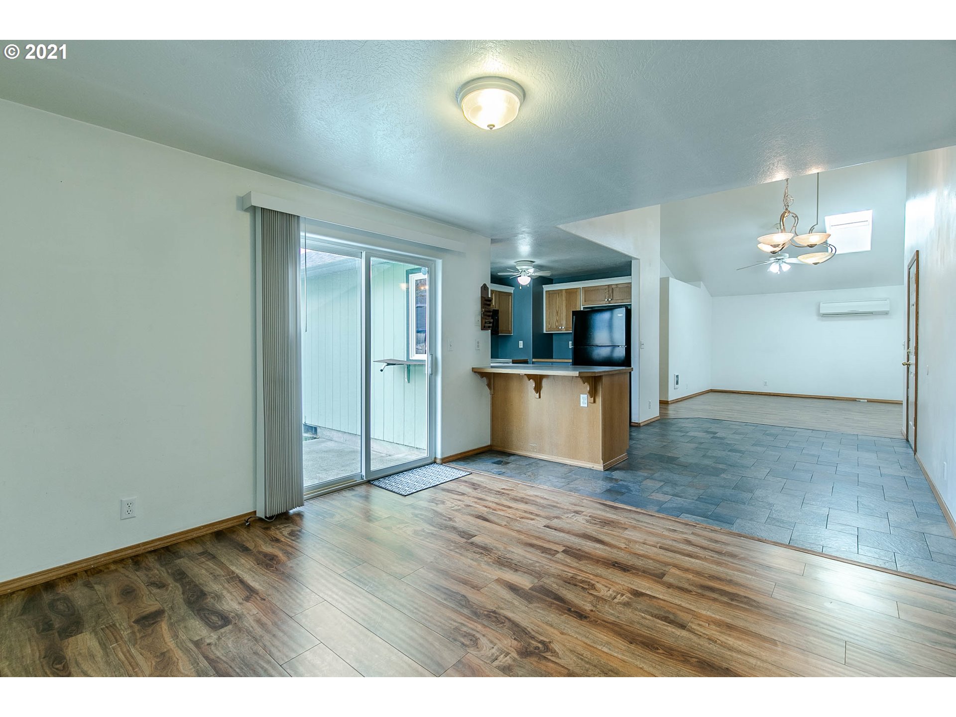 4049 Virginia Avenue Springfield, OR 97478 - Photo 15 of 32 a view of a kitchen with a sink cabinets and wooden floor