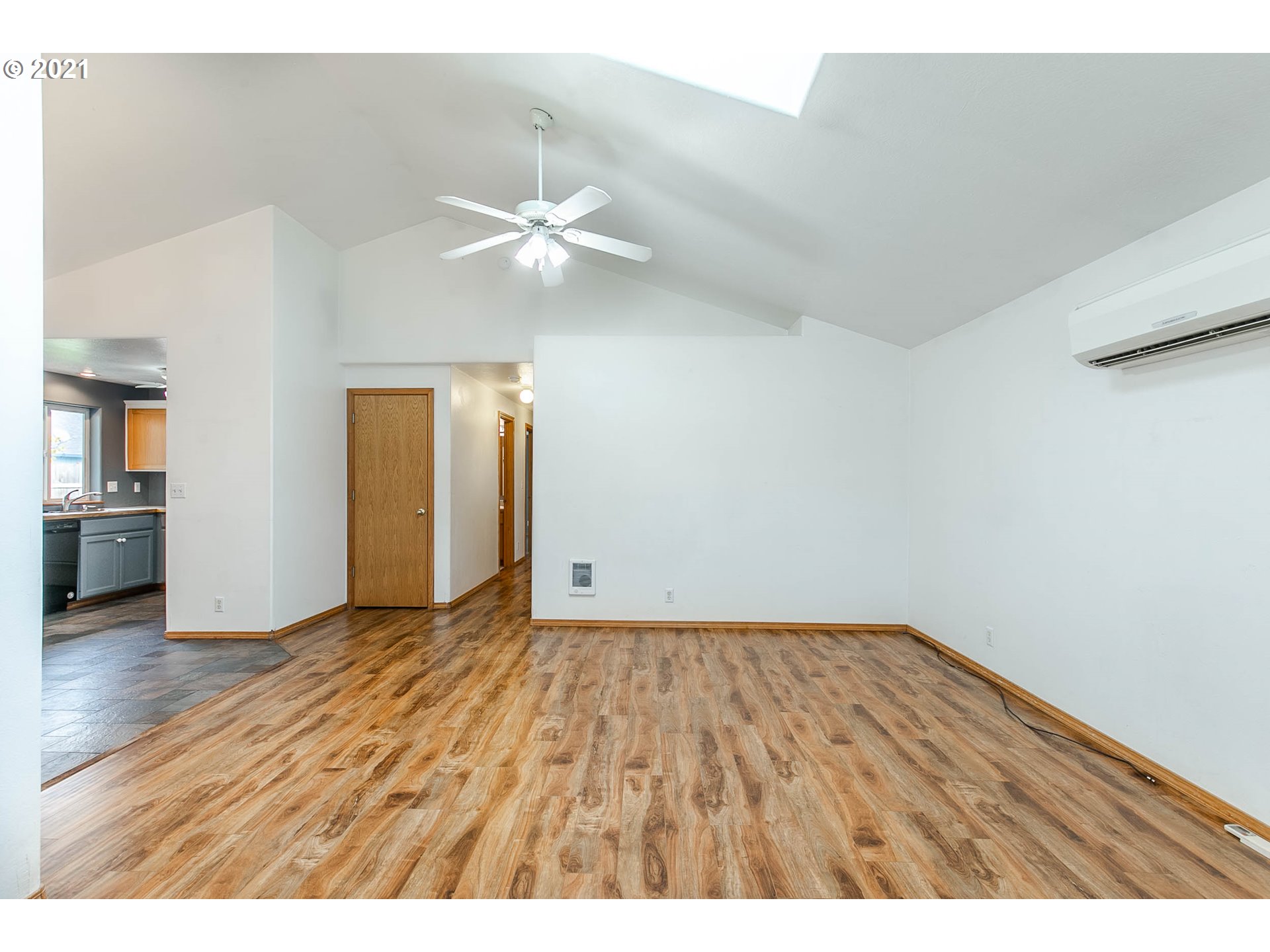 4049 Virginia Avenue Springfield, OR 97478 - Photo 5 of 32 a view of an empty room with window and wooden floor