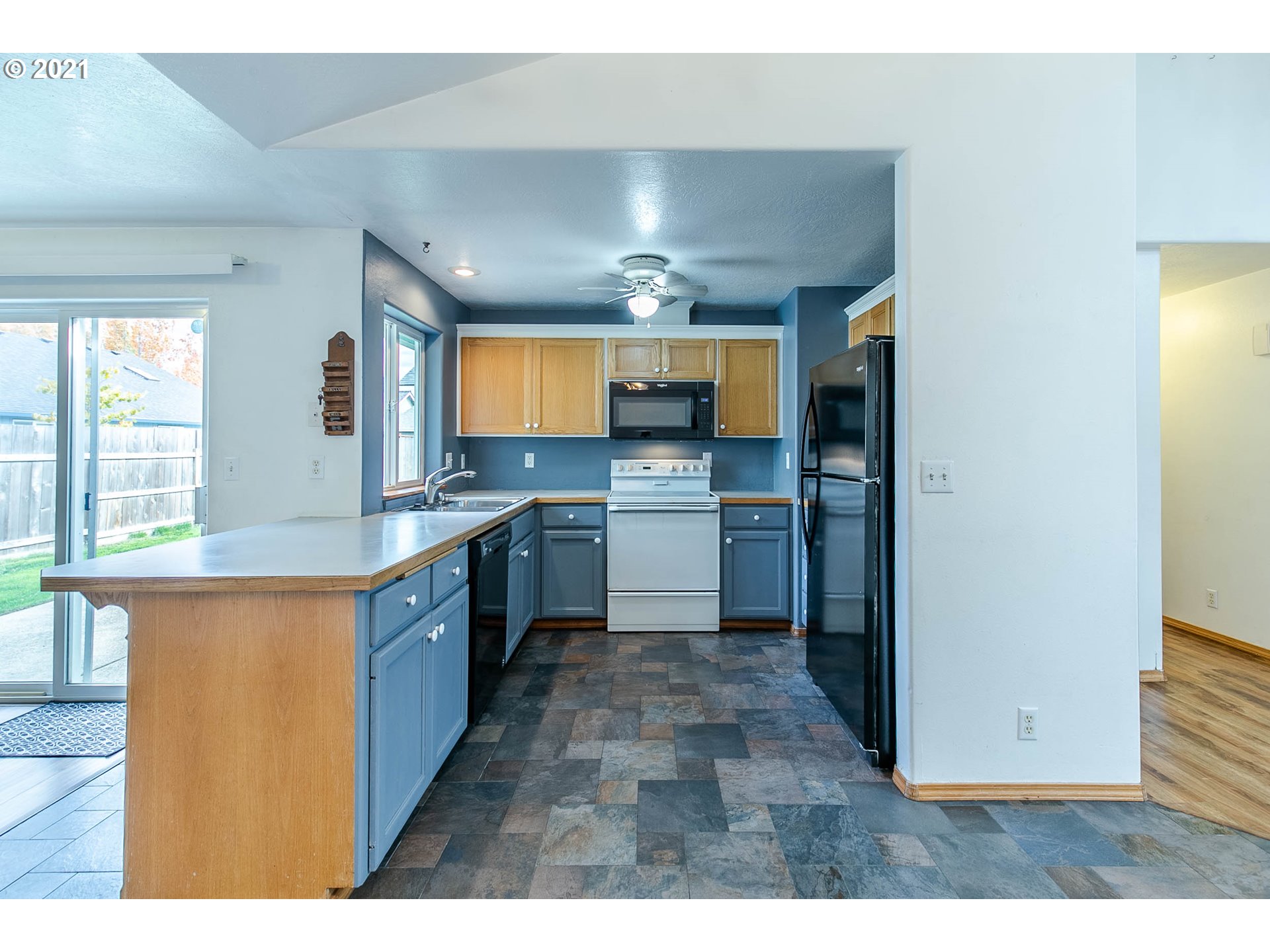 4049 Virginia Avenue Springfield, OR 97478 - Photo 7 of 32 a large kitchen with cabinets and stainless steel appliances